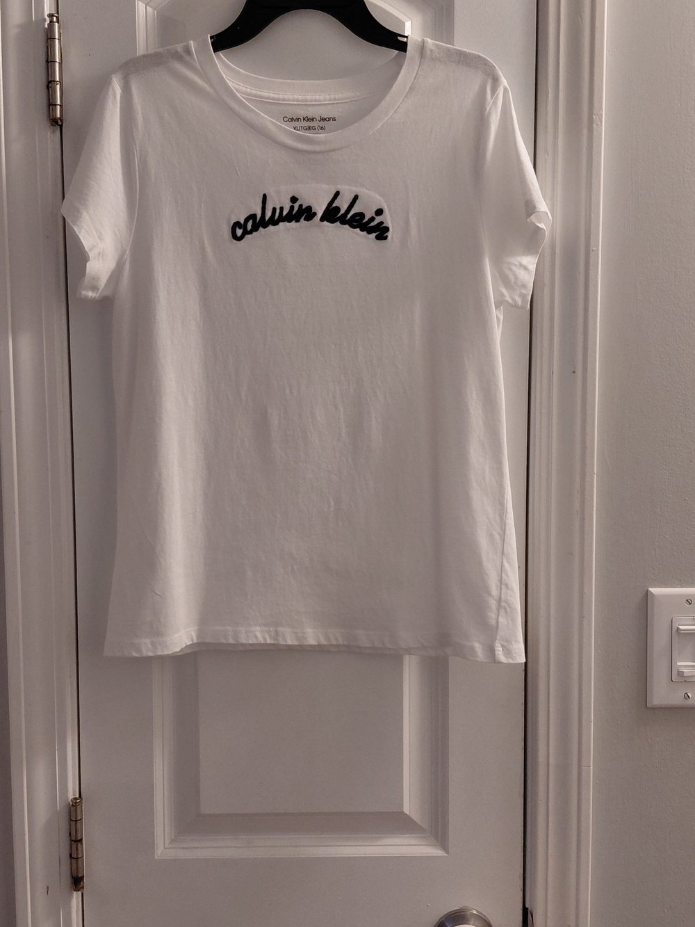 Calvin Klein Jeans Girls White Tee with Black Script Embroidery